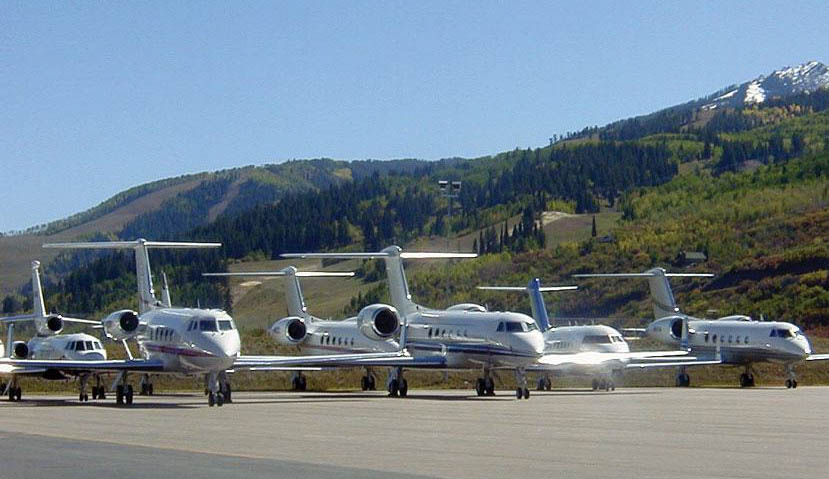 Large-cabin Gulfstream, Challenger and Falcon jets on the ramp at Aspen-Pitkin County Airport.