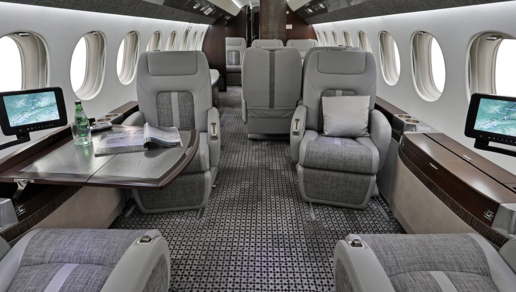 Cabin interior of Falcon 7X long range jet for charter operated by Plane Nine.